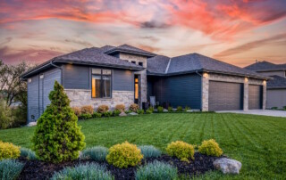 home with new roof and siding at sunset