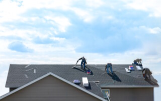contractors repairing a roof